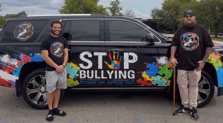 Cody Greggs-Dorsey and Jason Lewis with the OGWOGD Stop Bullying truck